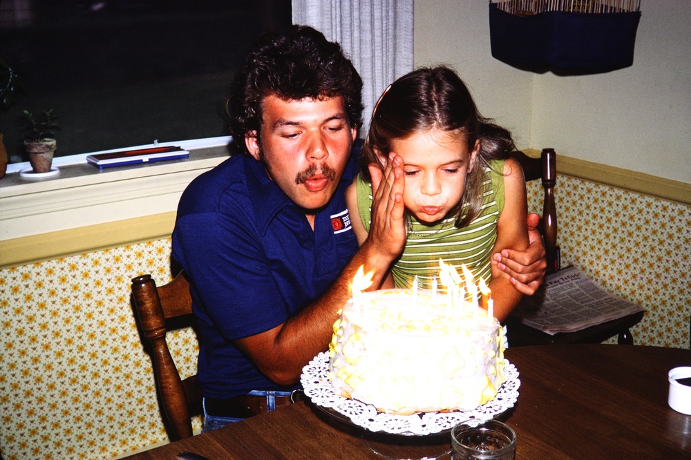  My brother Tom and I with our shared birthday cake!  Apparently when you share a cake you must make sure to only blow out your half of the candles or it messes with the wishes. 