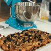 platter of sticky buns in front of Ocean Drive colored KitchenAid 5qt Artisan Stand Mixer fitted with dough hook