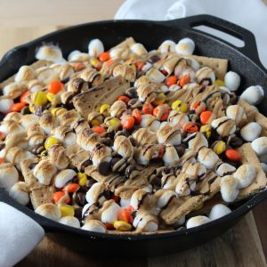 Peanut Butter Skillet S'mores Nachos - Baked and Drizzled with chocolate and peanut butter sauce