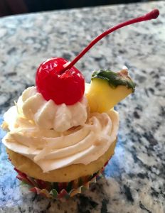 Pina Colada Cupcake with Rum Whipped Cream - photo taken after overnight in the refrigerator, the rum slightly deflates with whipped cream.

