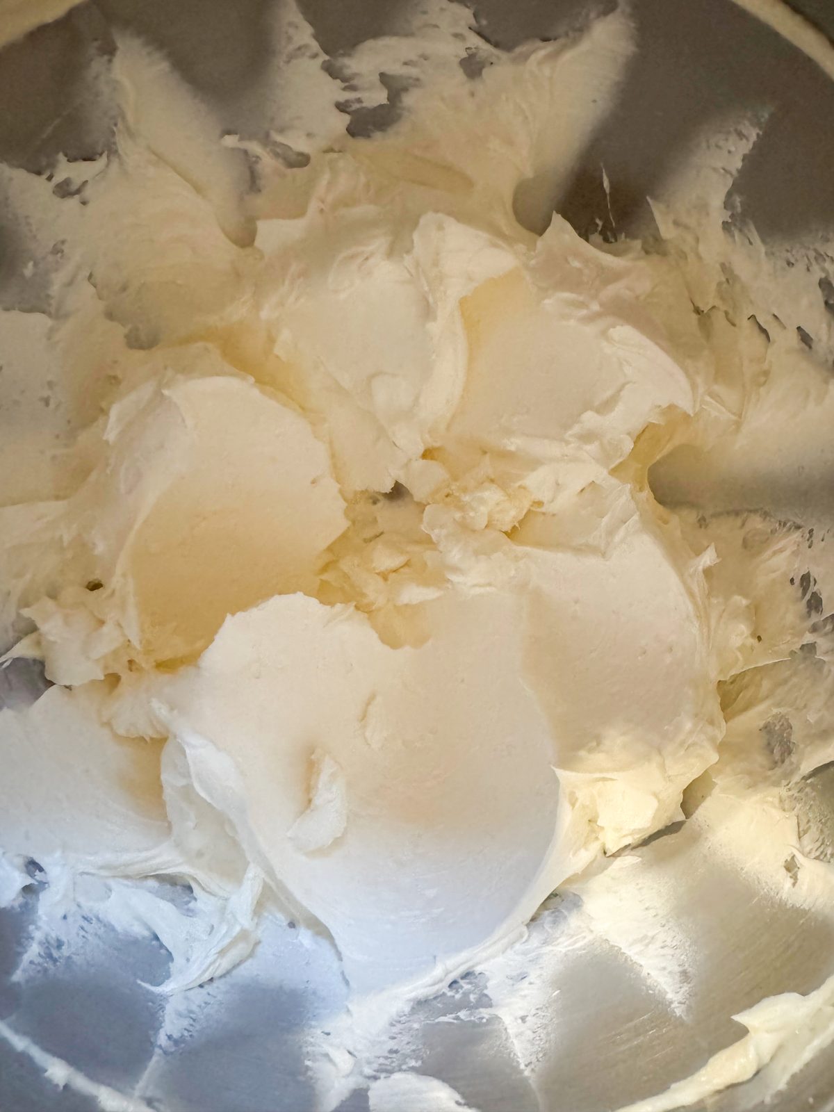 Recipe Photo for Less Sweet American Buttercream Frosting.  Mixed frosting in stainless steel stand mixer bowl.